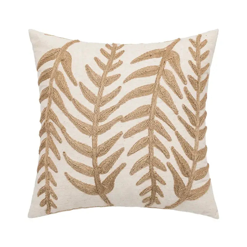 Cream-colored cushion cover with intricate textured gold leaf embroidery in decorbites linen embroidery leaves design