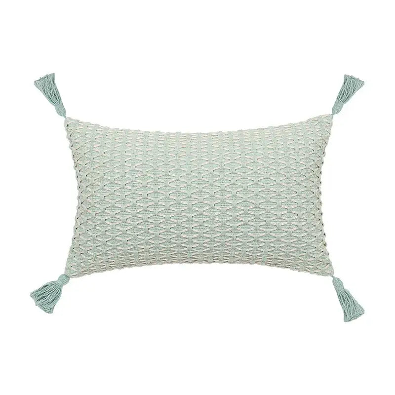 A light mint green cushion cover with linen embroidery leaves textured pattern and matching tassels for decorbites linen embroidery