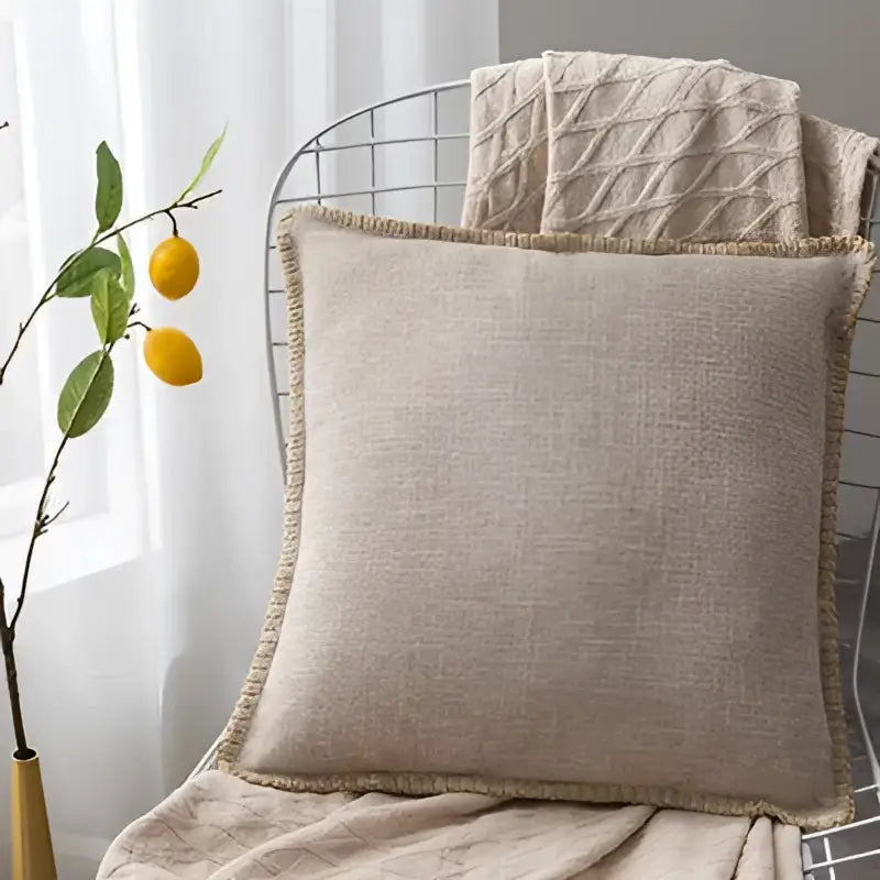 Beige linen fringe cushion cover with frayed edge detailing for neutral tones living room decorbites linen fringe pillow