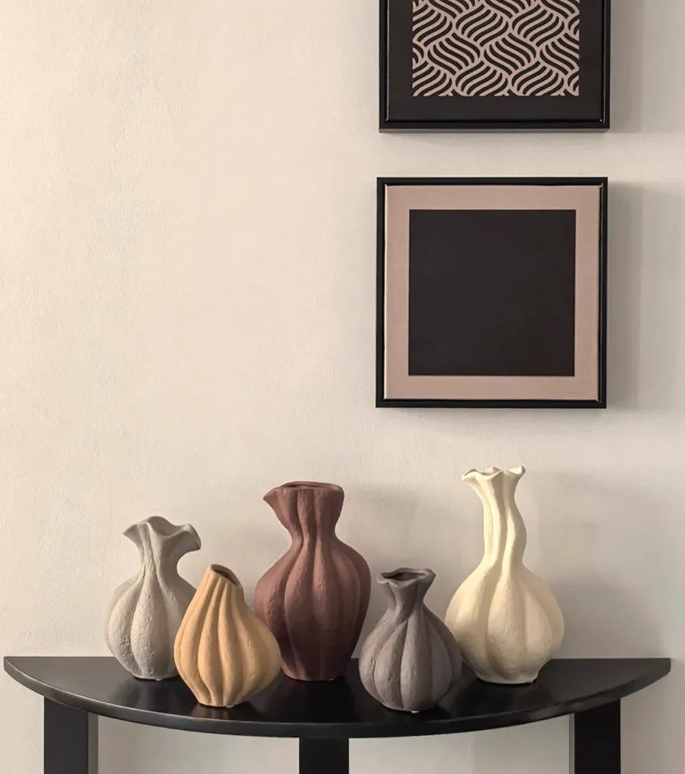 A collection of six livetai wabi-sabi handmade ceramic vases in earthy tones with textured surfaces for modern boho decor