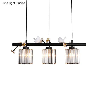 DecorBites black island pendant light with clear crystal cylinder shades and white ceramic birds on floral accents