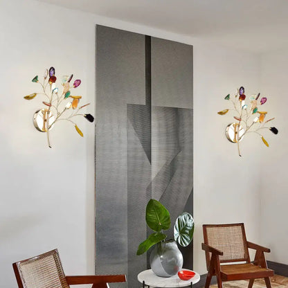 Colorful glass leaf wall lighting with metallic branch and gold-toned metal featuring colored crystal deco accents