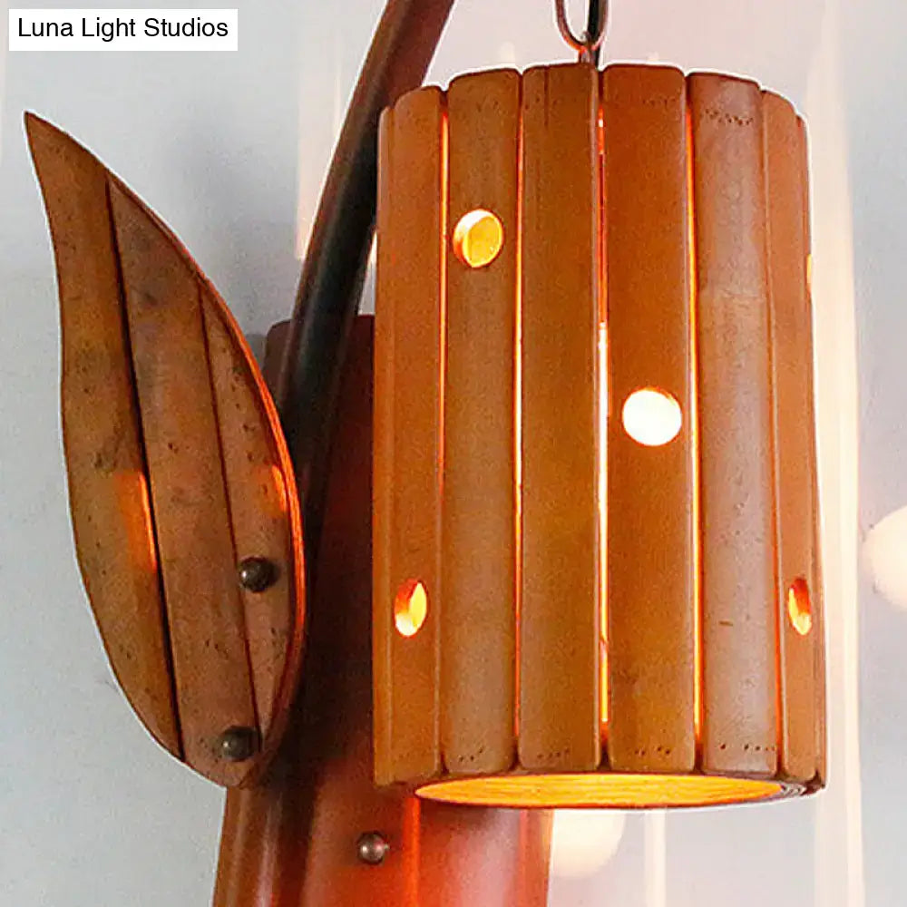 Lodge style brown wooden wall lamp with warm-toned bamboo slats and leaf accent compatible with 220v-240v led incandescent fluorescent bulbs