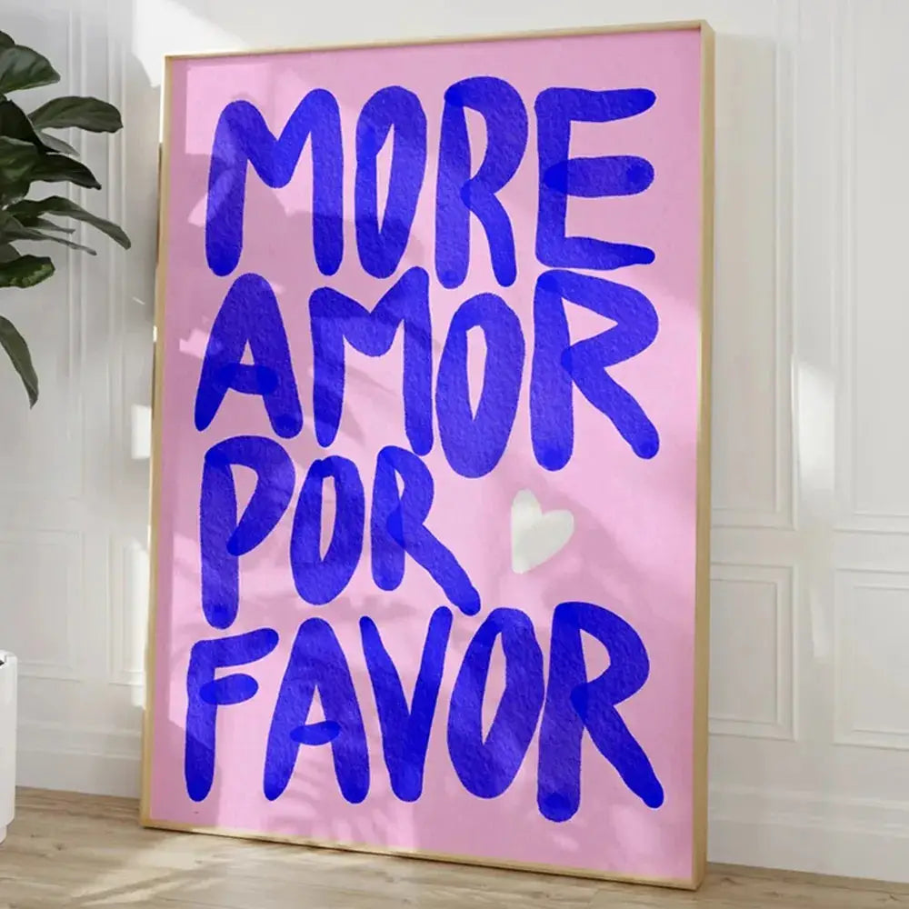 A framed DecorBites™ canvas wall art featuring a bold blue kind love quote on soft pink with a small white heart