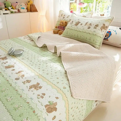 Soft quilted mint green and cream mattress mat with embroidered woodland animals and decorbites cartoon pattern cotton