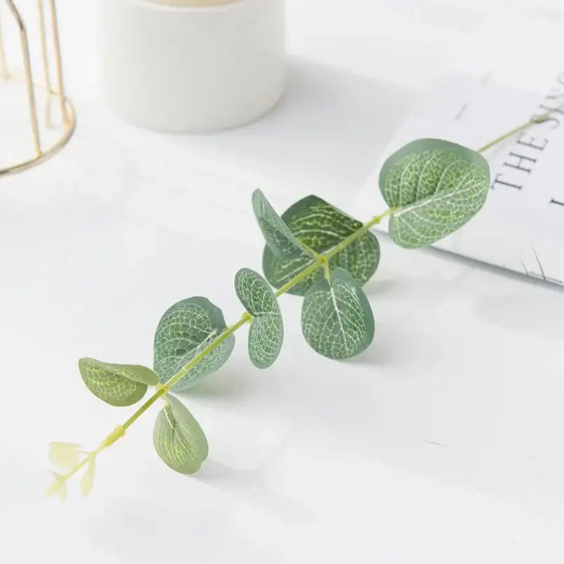 Lush artificial eucalyptus leaves garland with white flowers featuring realistic green decorbites eucalyptus leaves for wedding decor