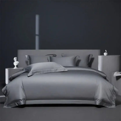 Gray satin bedding set with matching pillows and modern headboard contrasts with luxe burgundy red egyptian cotton bedding set