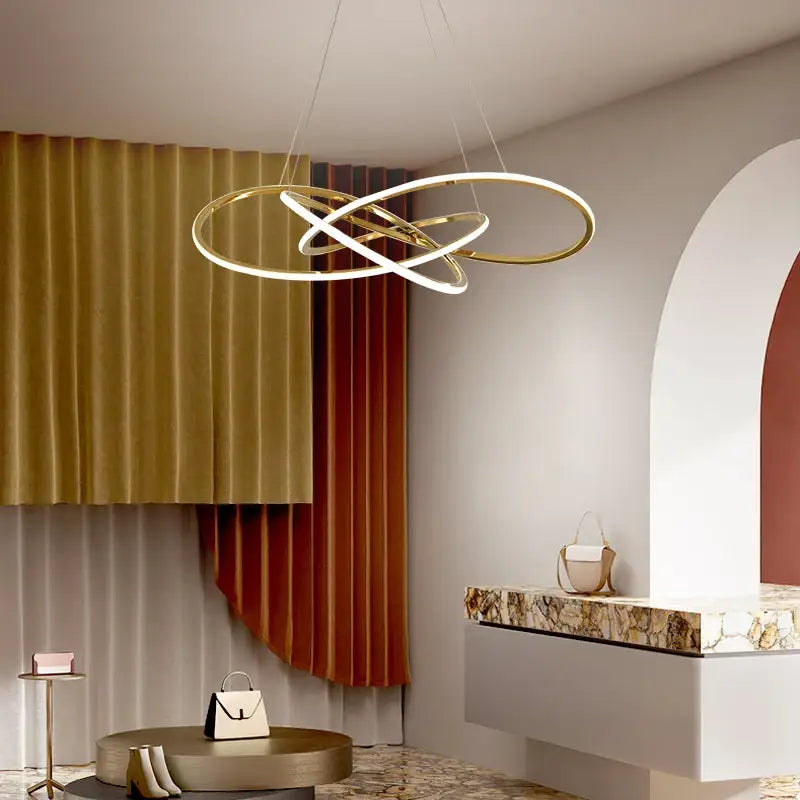 Luxe four leaf gold stainless steel pendant lamp featuring gold-toned interlocking rings with integrated led lighting