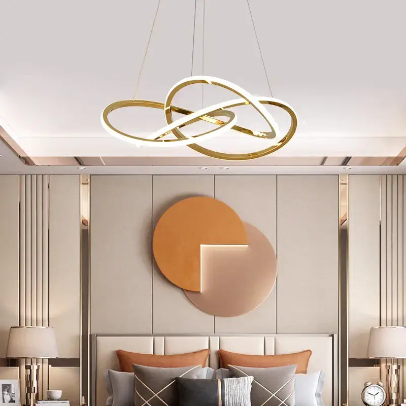 Luxe four leaf gold stainless steel pendant lamp with interlocking circular rings and integrated led lighting for dining room