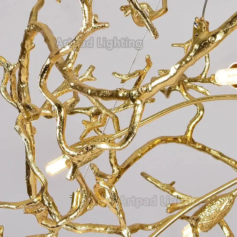 Golden luxe gold branch crystal led chandelier with branching metal arms and bird figurines for living room