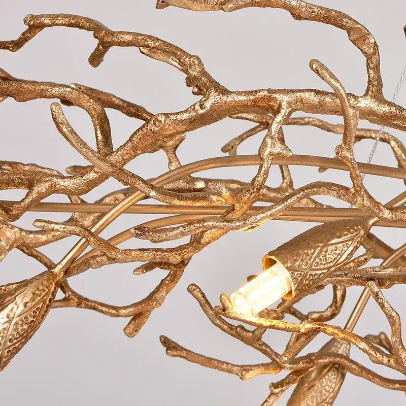 Luxe gold branch crystal led chandelier with intricate bird-shaped fixtures and textured metallic finish for living room