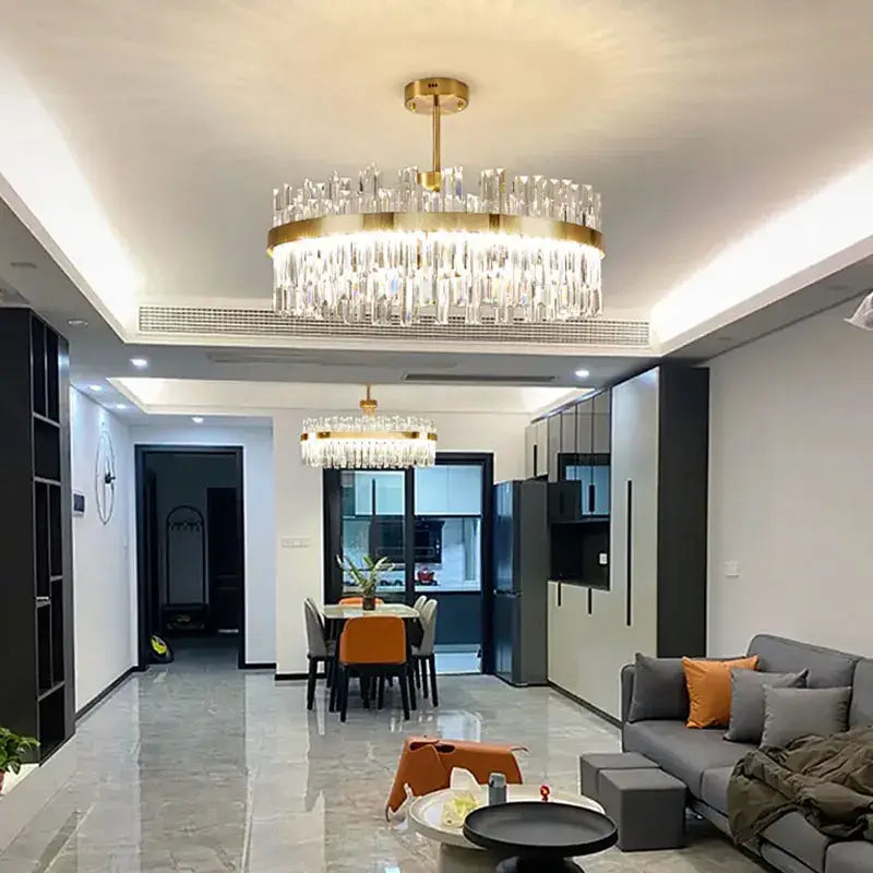 Luxe gold crystal round ceiling chandelier with cascading clear crystal prisms for dining room decorbites crystal round