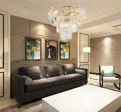 A luxe gold steel crystal pendant light dining room chandelier with multi-tiered cascading clear crystals and gold accents