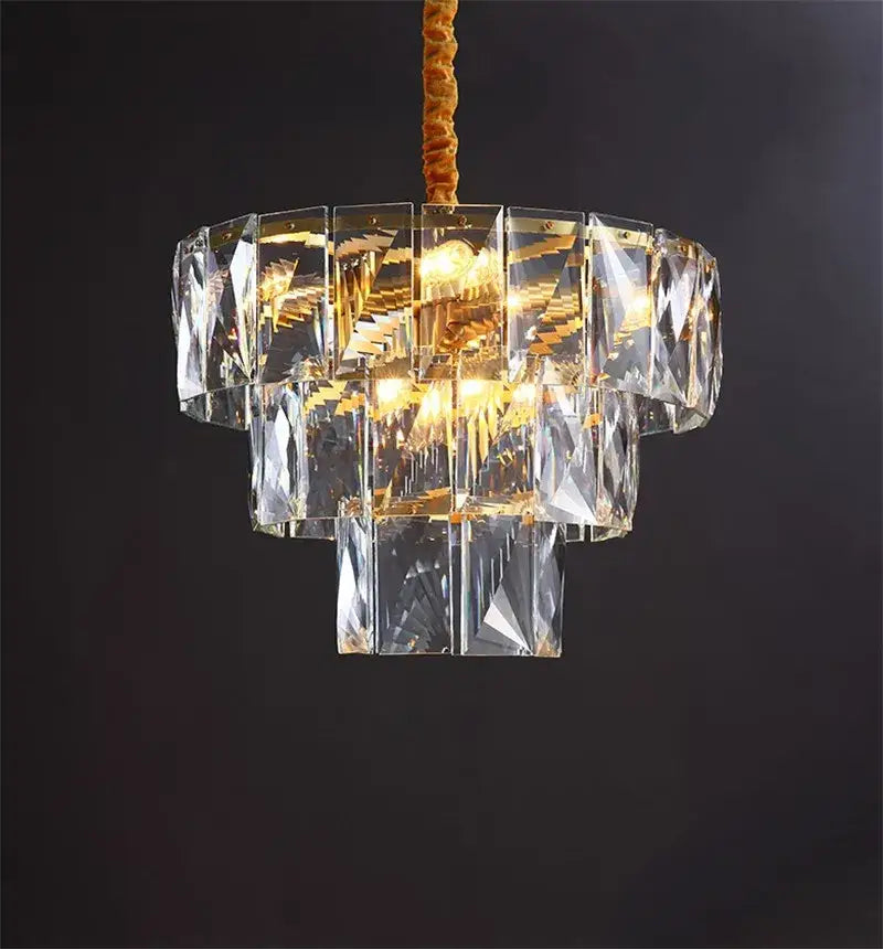 Luxe gold steel crystal pendant light with multi-tiered faceted glass panels and gold steel crystal structure for dining room decorbites