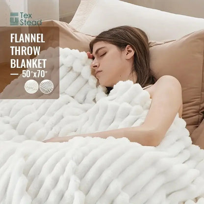 Luxe ribbed white flannel throw blanket featuring a plush textured knit pattern for bedroom plush decor