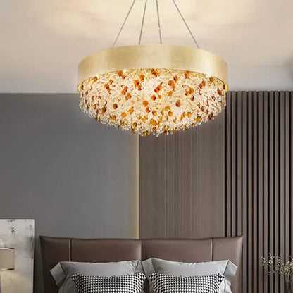 Luxurious decorbites circular crystal chandelier with gold tone and cascading amber and clear crystal beads pendant light