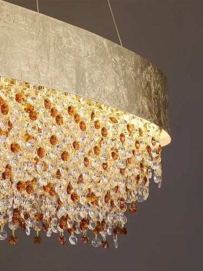Luxurious gold circular crystal chandelier pendant with textured metallic shade and cascading amber and clear beads for decorbites circular crystal decor