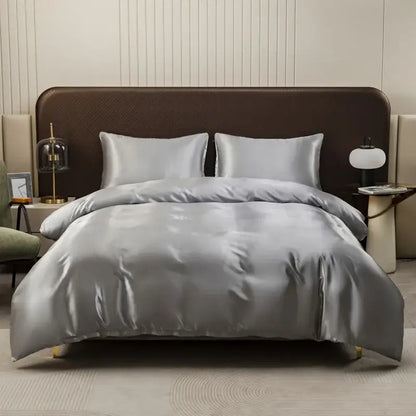 Silver satin duvet cover and pillowcase set with smooth glossy finish and elegant drape by decorbites ice rayon