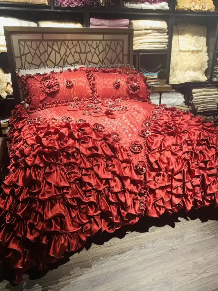 Luxurious red satin bedding set with layered ruffles and embroidered roses from decorbites jacquard rose lace collection