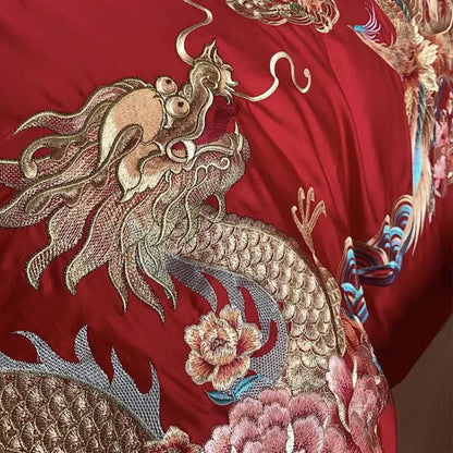 Luxurious red satin bedding set with gold loong phoenix embroidery and floral motifs for elegant bedroom decor
