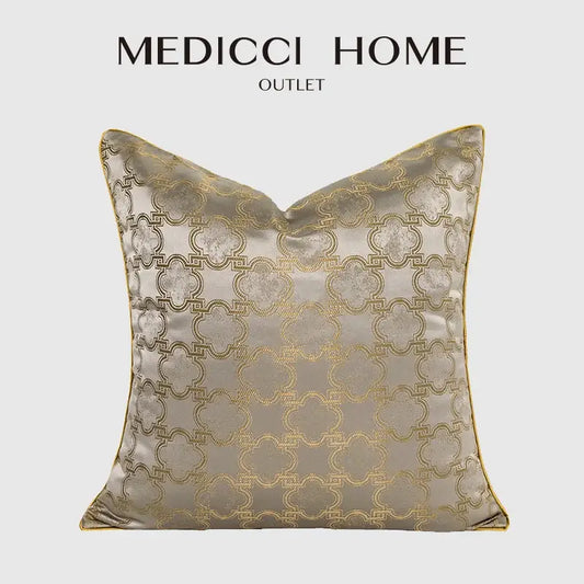 Luxury beige satin pillow cover with intricate gold quatrefoil geometric embroidery and matching gold trim for decorbites decor