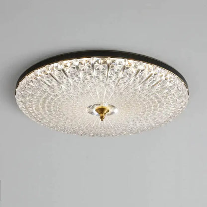 Luxury black and gold glass round ceiling lamp with clear crystal glass, black metal frame, and brass center for bedroom use