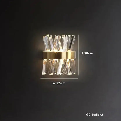 Modern crystal wall sconce with gold-toned metal base and clear glass complements decorbites black stainless steel chandelier