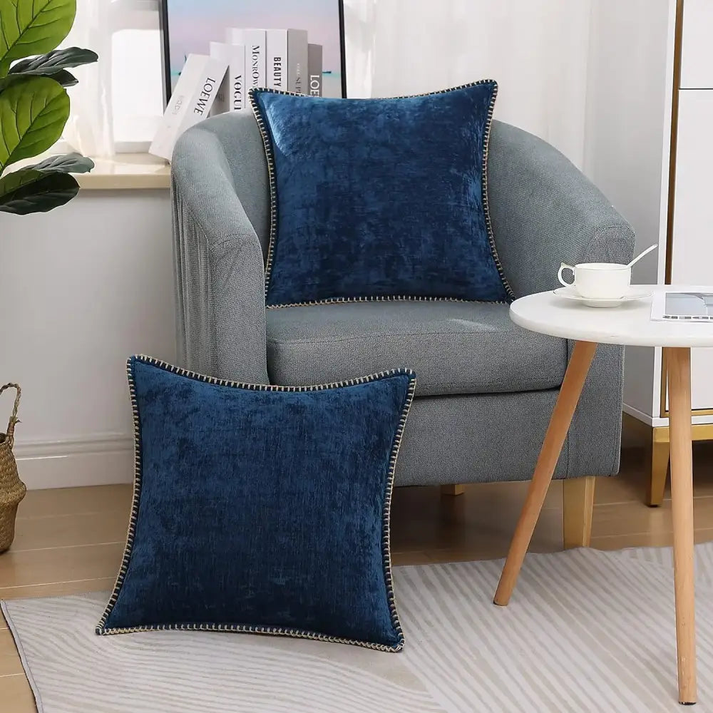 Luxury deep blue chenille cushion covers with stitched edges and gold-toned nailhead trim for elegant decorbites decor