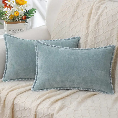 Two light blue chenille cushion covers with stitched edge and subtle texture for luxury decorbites living room decor