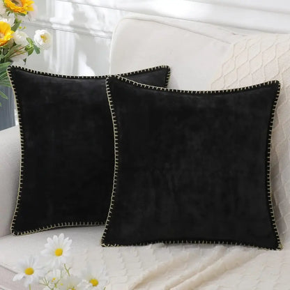 Black velvet square throw pillows with contrasting cream stitched edges complement decorbites blue chenille cushion covers