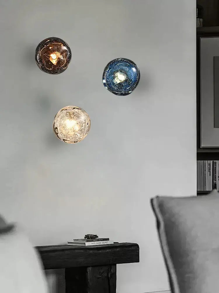Luxury blue crystal glass wall lamp with three crackled spherical sconces in amber deep blue and frosted gold hues
