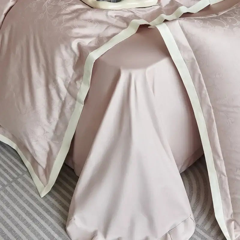 Luxury blush pink floral jacquard satin duvet cover set with delicate embroidery and cream piping for bedroom bedding