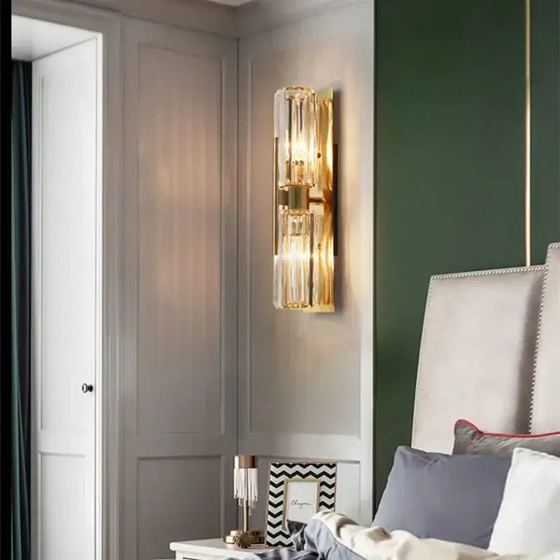 Luxury brass crystal wall lamp with gold-toned vertical ribbed glass tubes for bedroom decorbites crystal wall lamp