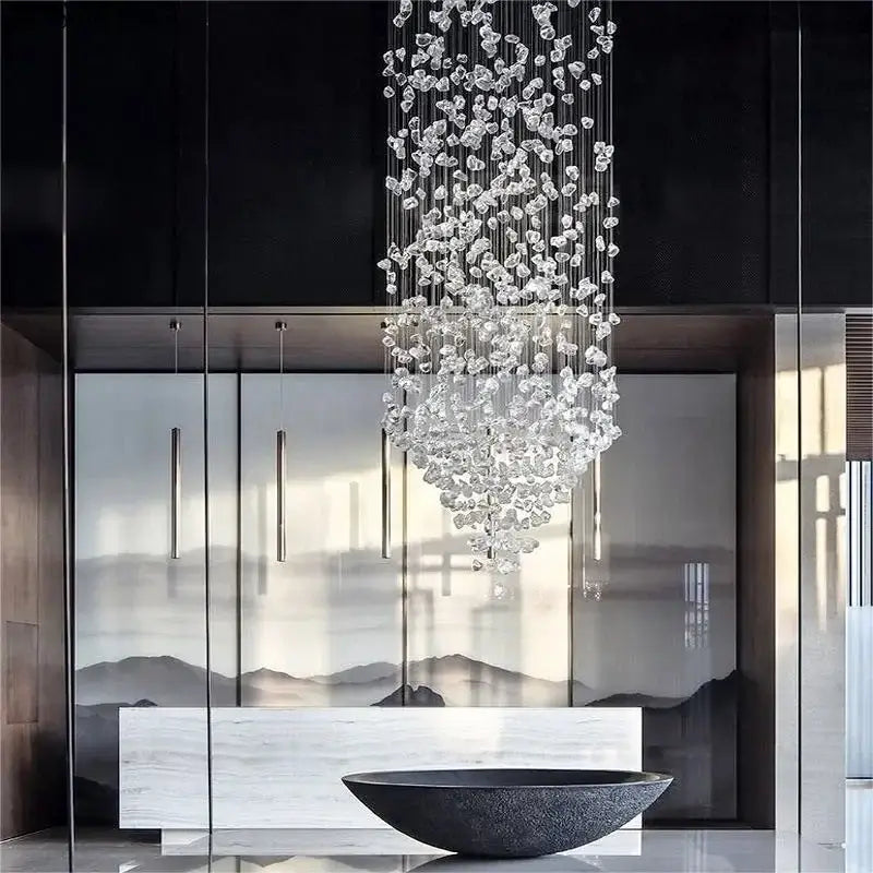 Luxury cascading crystal led chandelier with clear faceted glass pieces suspended on thin metallic wires decorbites crystal led