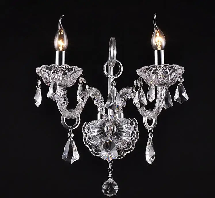 Luxury clear crystal wall lamp with two candle-style bulbs and intricate decorbites clear crystal arms and teardrops