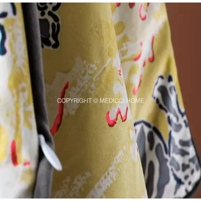 Yellow curtain with abstract stylized animal figures in black gray and red complements decorbites coral lynx velvet cushion cover