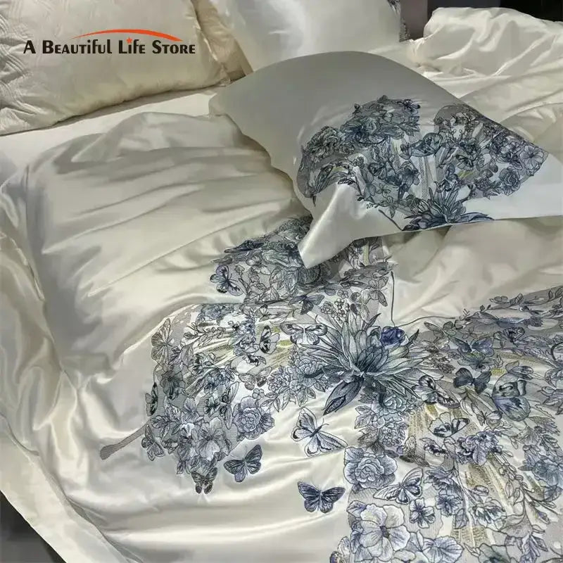 Luxury cream satin bedding set featuring intricate blue decorbites butterfly flowers embroidery for elegant bedroom decor