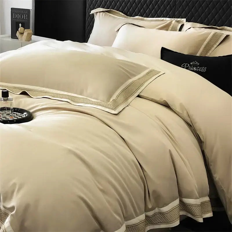 Cream-colored satin bedding set with gold embroidery and black pillow embroidered princess by decorbites 1000tc luxury