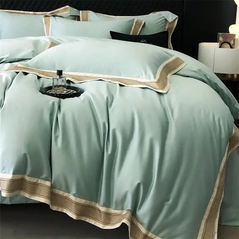 Luxurious mint green satin bedding set with cream and gold embroidered trim from decorbites 1000tc luxury embroidery collection