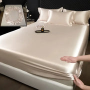 Luxury cream mulberry silk fitted sheet set with smooth glossy satin finish and elasticized edges for a fitted sheet set
