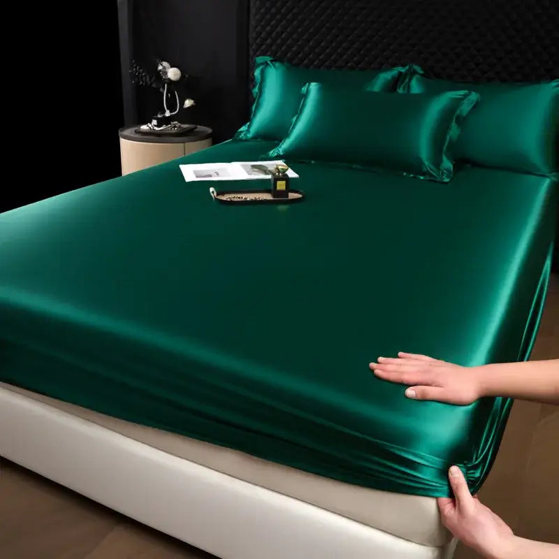 Emerald green satin fitted sheet set with matching pillowcases from luxury cream mulberry silk bedroom bed linen collection