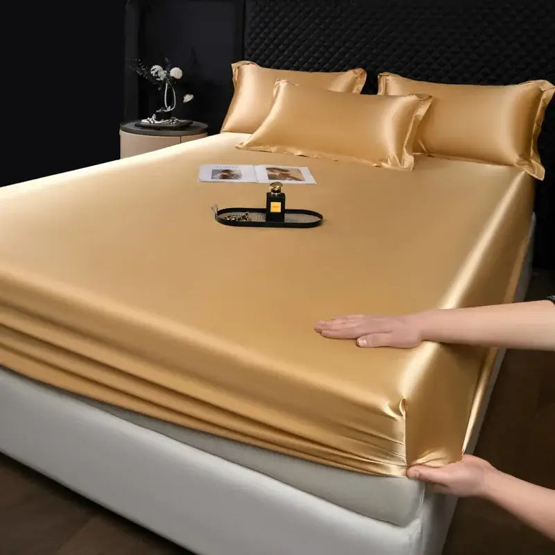 Luxury cream mulberry silk fitted sheet set featuring a golden satin fitted sheet with a smooth glossy finish