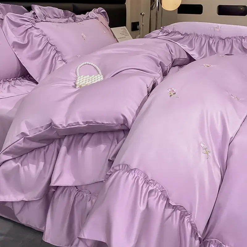 Lavender satin bedding set with delicate floral embroidery and ruffled edges from luxury cream and pink ice silk bedding sets by decorbites ice silk