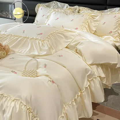 Luxury cream and pink ice silk bedding sets with delicate rose embroidery and layered ruffles for elegant decorbites ice silk decor