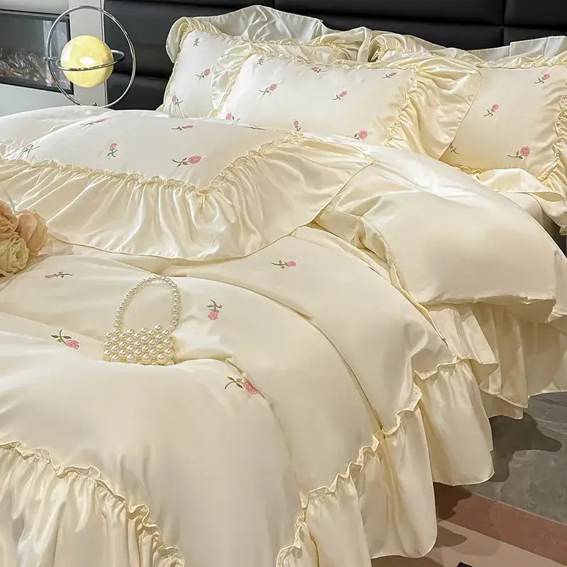 Luxury cream and pink ice silk bedding sets with delicate rose embroidery and layered ruffles for elegant decorbites ice silk decor