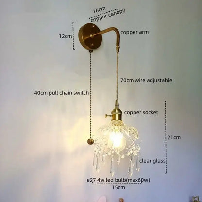 Antique brass copper led wall sconce with clear glass shade and dangling crystal droplets for luxury bedroom lighting
