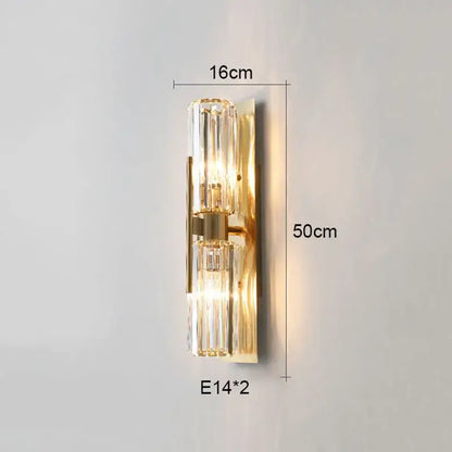 Luxury crystal gold wall lamp featuring gold-toned metallic frame with two vertical crystal glass shades for decorbites wall lamp