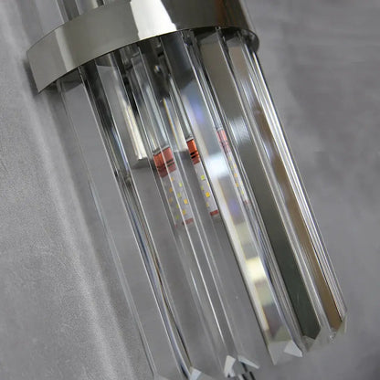 Modern crystal golden wall lamp with sleek chrome finish and clear faceted prisms for luxury living room decorbites decor