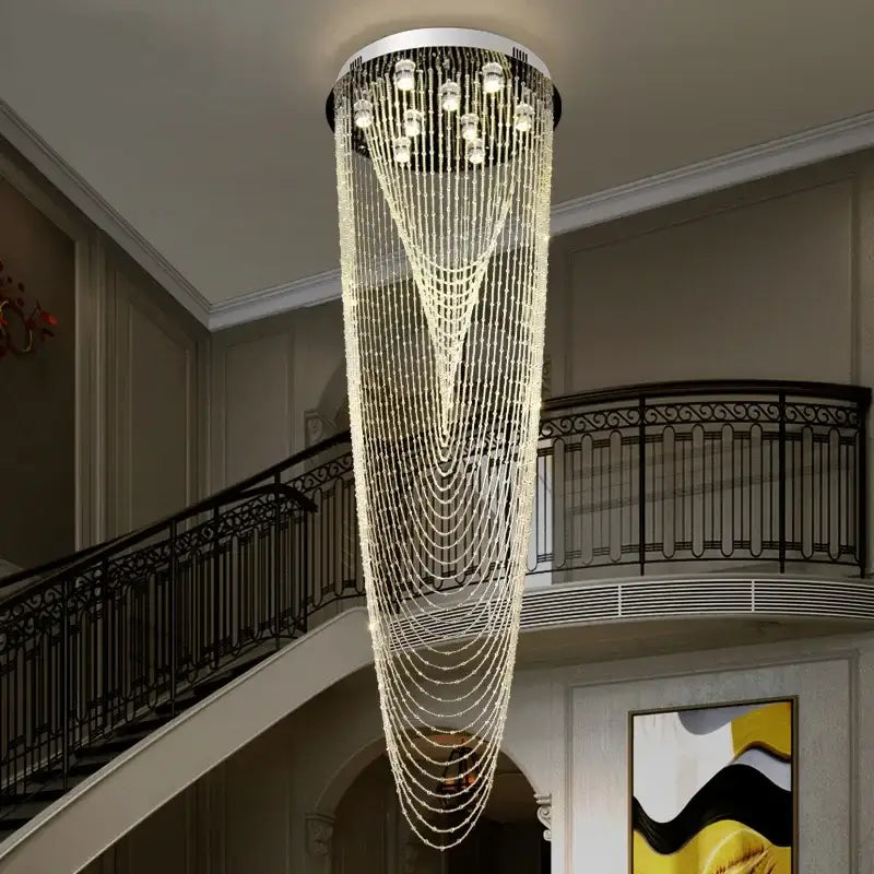 A luxury crystal tassel stair chandelier with cascading clear beads and lights on a sleek white frame for living room decorbites crystal tassel