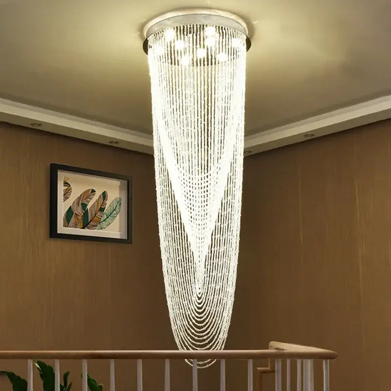 Luxury crystal tassel stair chandelier with cascading clear beads and chrome fixture for elegant living room decorbites lighting